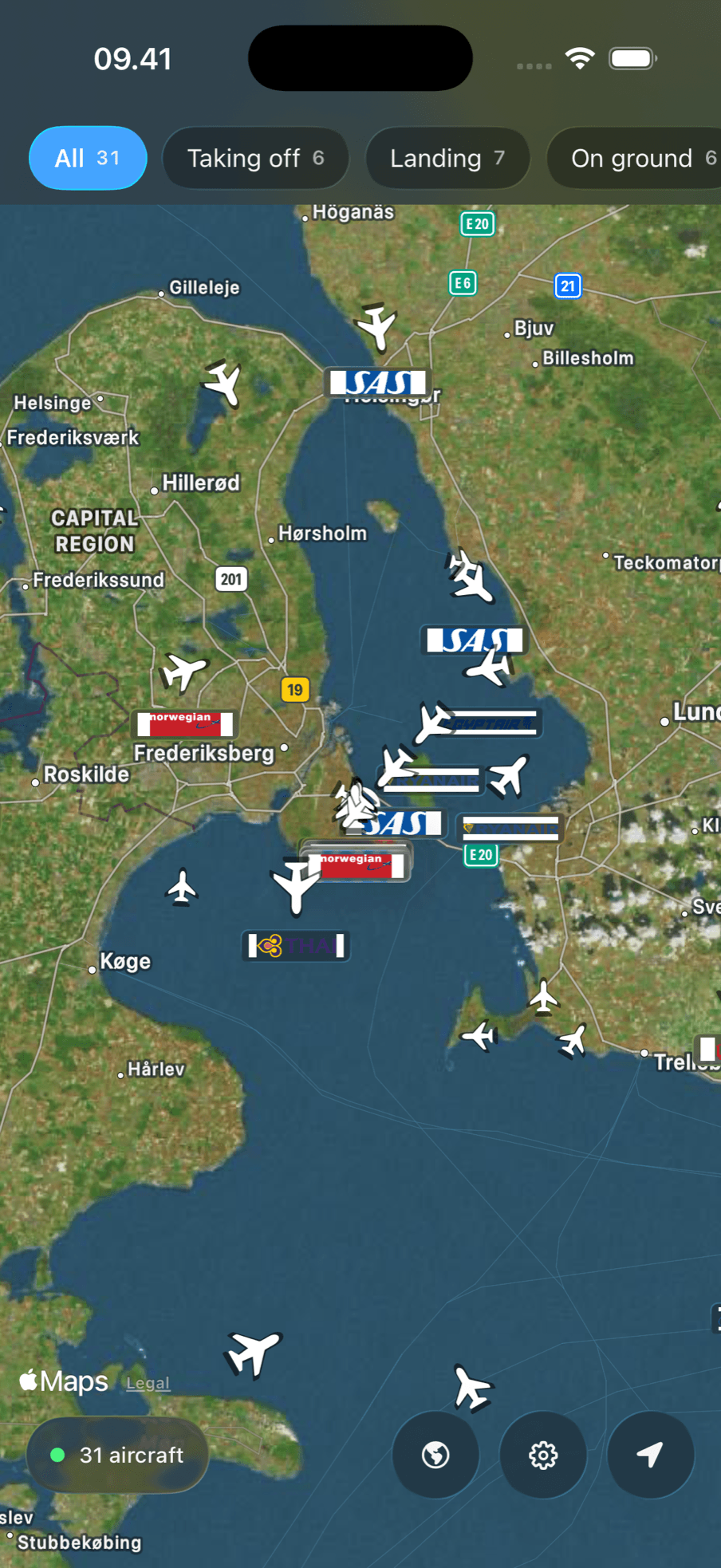 Live map over the Copenhagen area with aircraft pointing along their tracks, each marked with its airline logo, and filters for taking off, landing and on ground